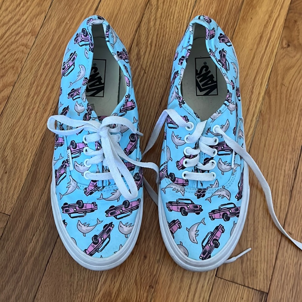 Dolphin and pink convertible vans